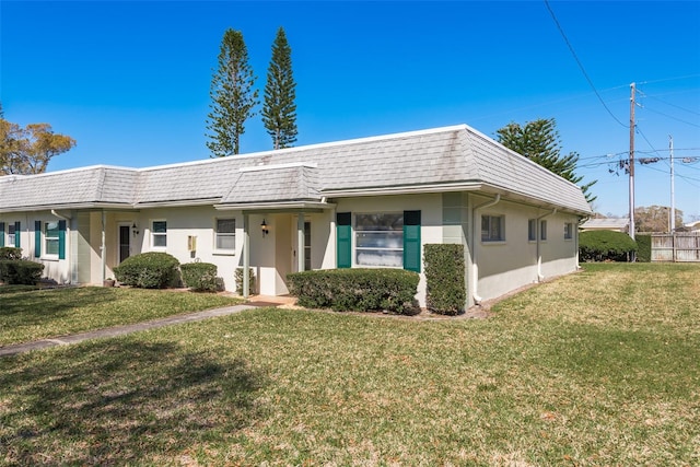 ranch-style house with a front lawn