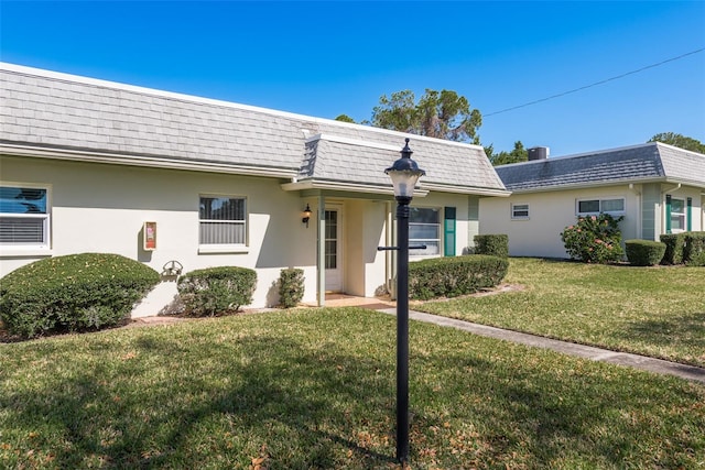 view of front of home with a front lawn