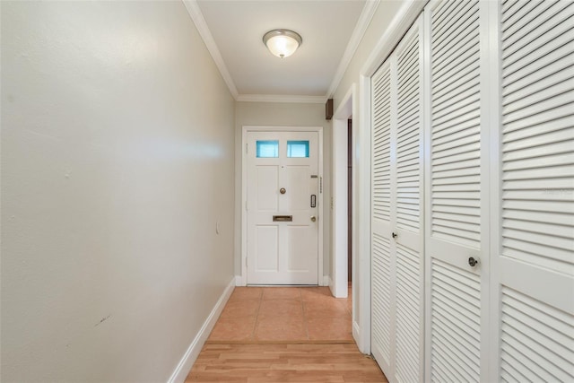 doorway to outside featuring light wood-type flooring and crown molding