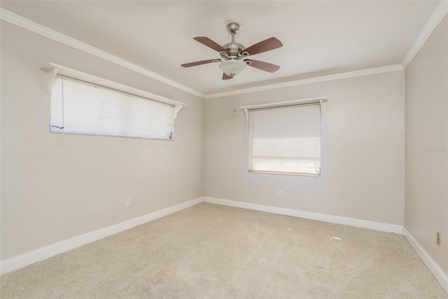 carpeted empty room with ornamental molding and ceiling fan