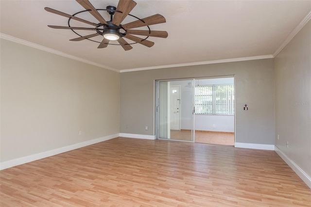 spare room featuring light hardwood / wood-style floors, ceiling fan, and crown molding