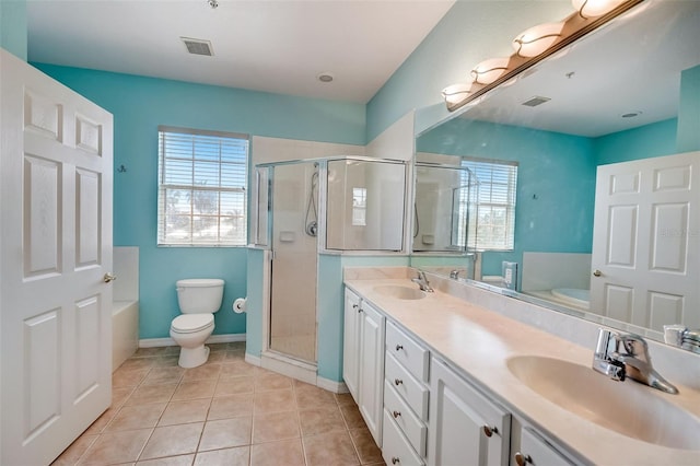 full bathroom with plenty of natural light, toilet, tile patterned floors, and vanity