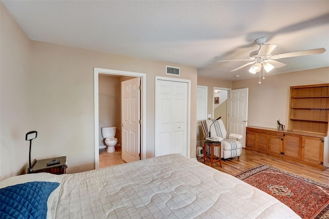 bedroom featuring ceiling fan, connected bathroom, and light wood-type flooring