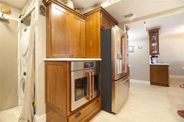 kitchen with stainless steel appliances and light hardwood / wood-style flooring