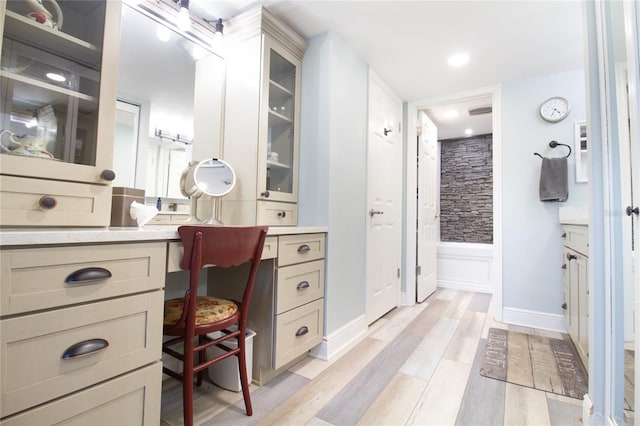 bathroom featuring vanity and hardwood / wood-style floors