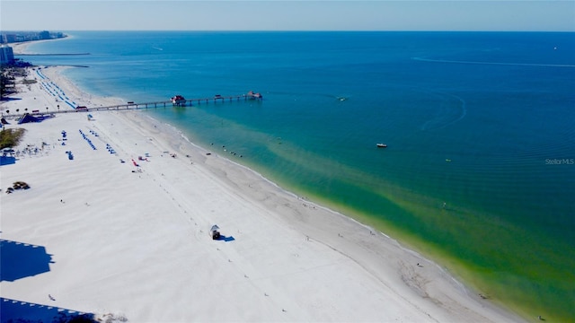 bird's eye view featuring a water view and a view of the beach