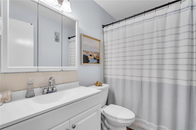 bathroom with decorative backsplash, toilet, a textured ceiling, and vanity