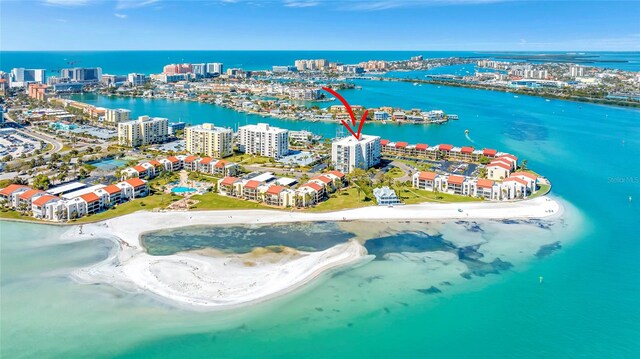 birds eye view of property featuring a water view and a view of the beach