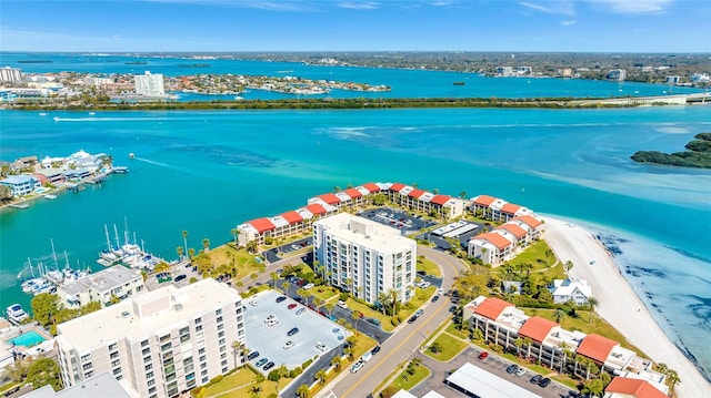 drone / aerial view featuring a view of the beach and a water view