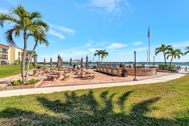 view of jungle gym featuring a water view and a yard