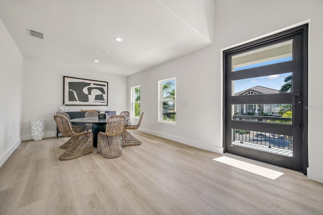 dining area featuring light wood-type flooring