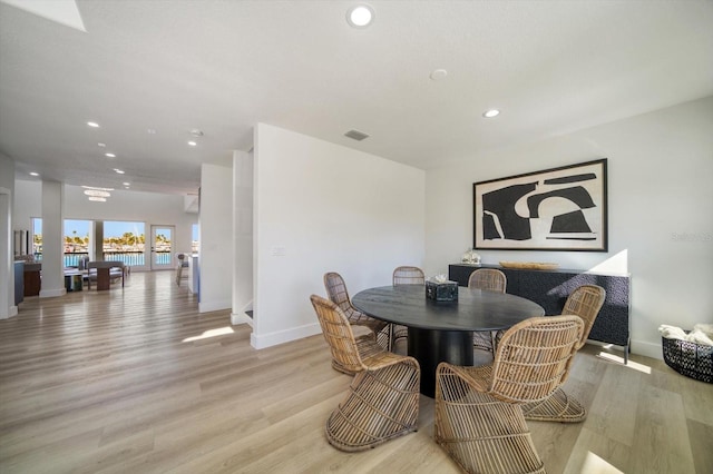 dining room with light hardwood / wood-style floors