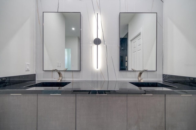 bathroom featuring tasteful backsplash and sink