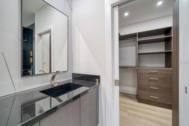 bathroom featuring wood-type flooring and vanity