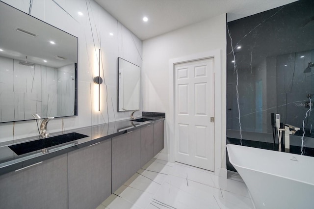 bathroom with tile floors, double vanity, and separate shower and tub