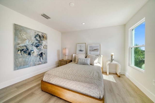 bedroom with light hardwood / wood-style flooring