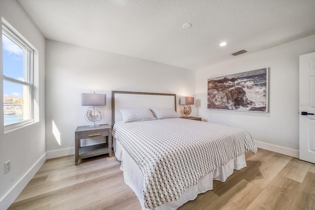 bedroom featuring light wood-type flooring