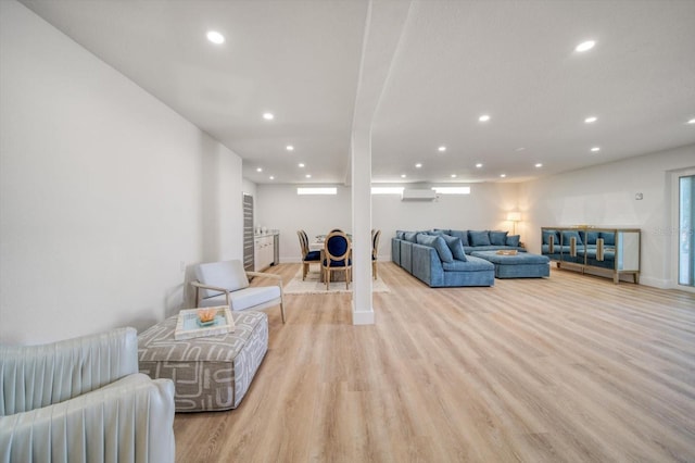 living room with light hardwood / wood-style flooring