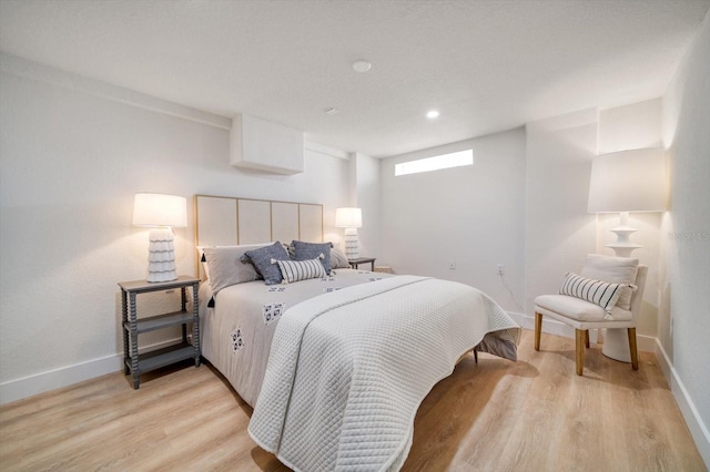 bedroom with light hardwood / wood-style floors