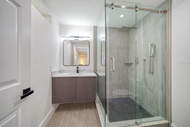 bathroom featuring tile floors, toilet, walk in shower, and vanity