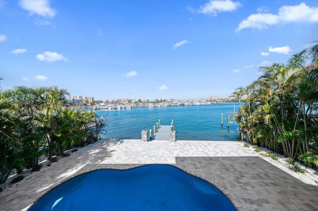 view of swimming pool with a water view