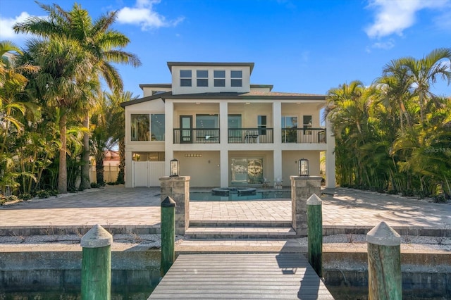 rear view of property with a balcony