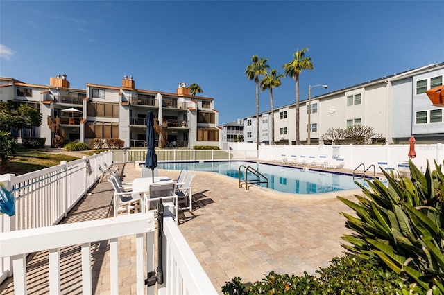 view of pool featuring a patio area