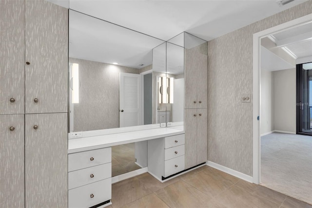 bathroom with tile flooring and vanity