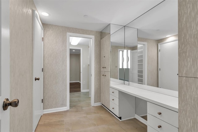 bathroom featuring tile floors and vanity