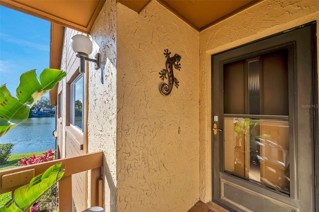 property entrance featuring a water view