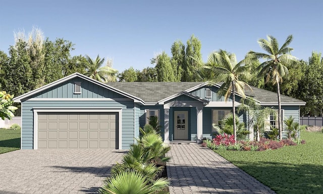 view of front of home featuring a garage and a front lawn