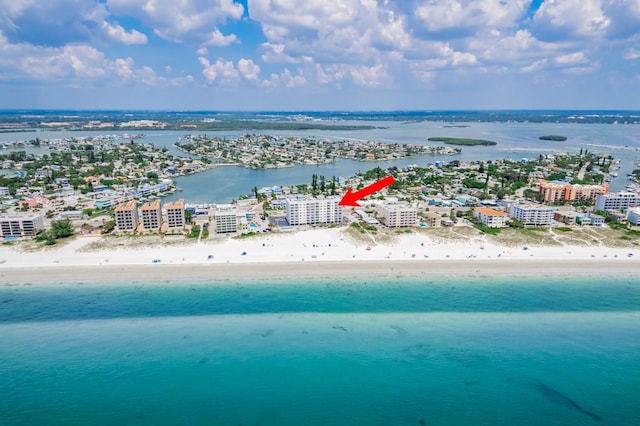 drone / aerial view featuring a view of the beach and a water view