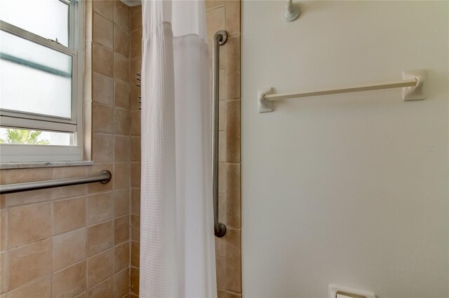 bathroom featuring walk in shower