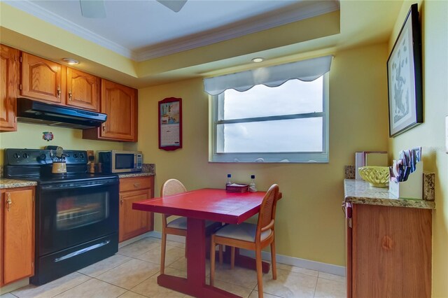 kitchen featuring a tray ceiling, light tile patterned floors, electric range, and ornamental molding