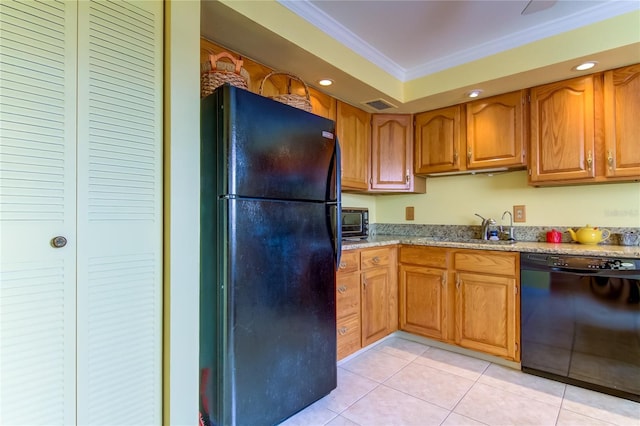 kitchen with sink, crown molding, light tile patterned floors, light stone countertops, and black appliances