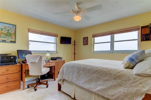 bedroom featuring light tile patterned floors and ceiling fan