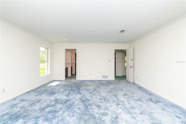 empty room with light colored carpet and ornamental molding