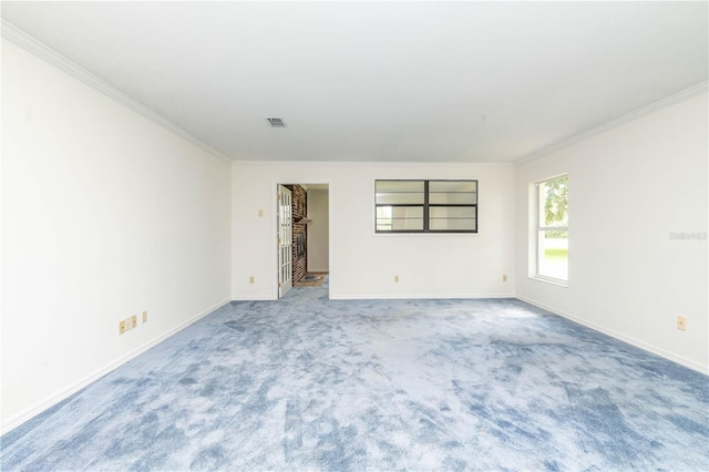 unfurnished room featuring ornamental molding and light colored carpet