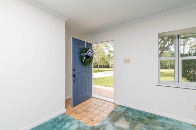 entryway featuring light tile floors, a wealth of natural light, and ornamental molding