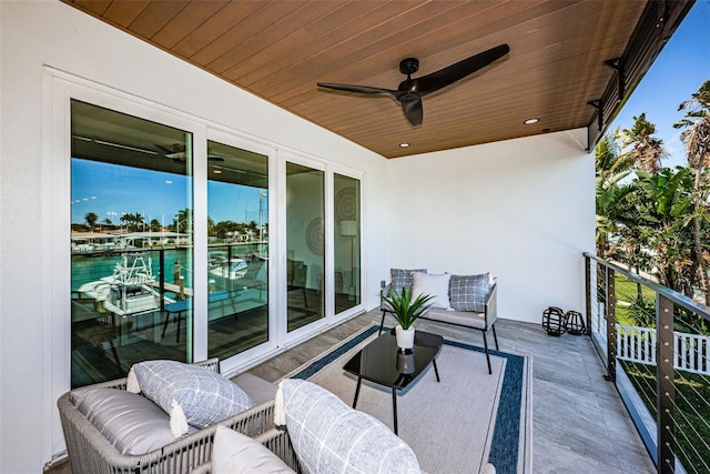 view of patio / terrace with a balcony, ceiling fan, and outdoor lounge area