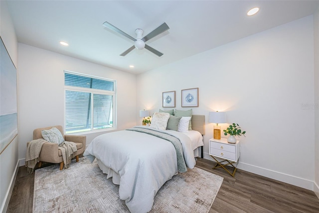 bedroom with hardwood / wood-style floors and ceiling fan