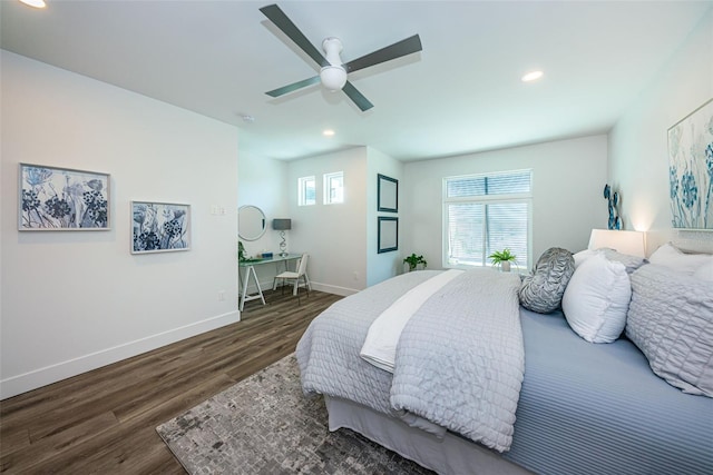 bedroom with ceiling fan and dark wood-type flooring