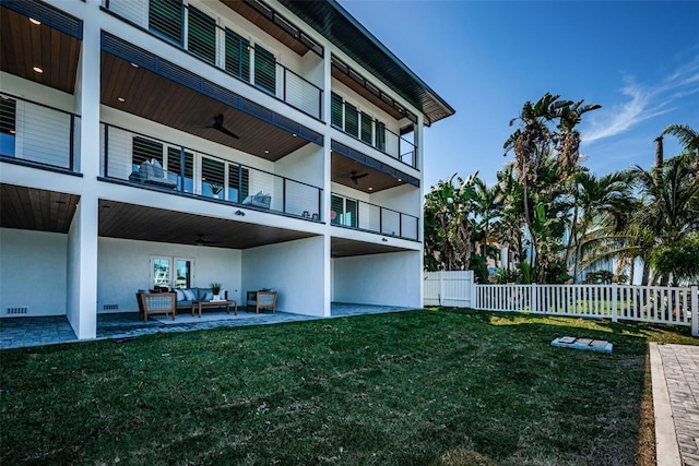 exterior space with a patio area and a lawn