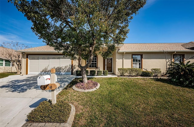 ranch-style home featuring a front yard and a garage