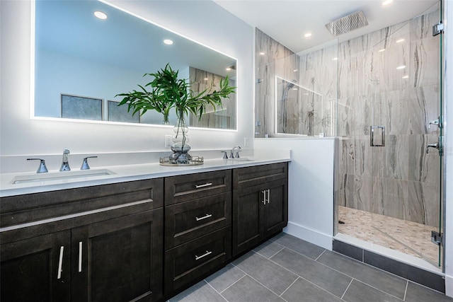 bathroom featuring an enclosed shower, tile floors, and double sink vanity