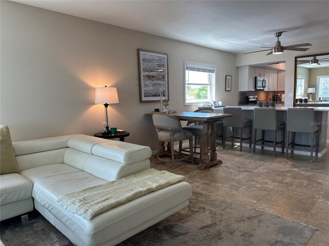 living room with ceiling fan