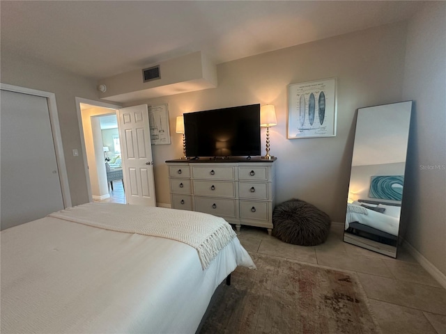 bedroom featuring light tile patterned floors