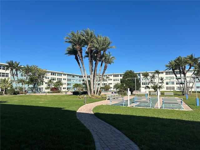 view of home's community featuring a lawn