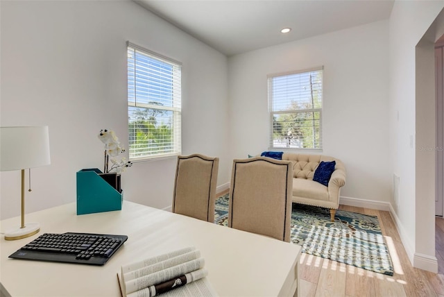 office with light wood-type flooring