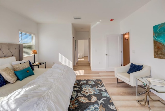 bedroom with light hardwood / wood-style floors